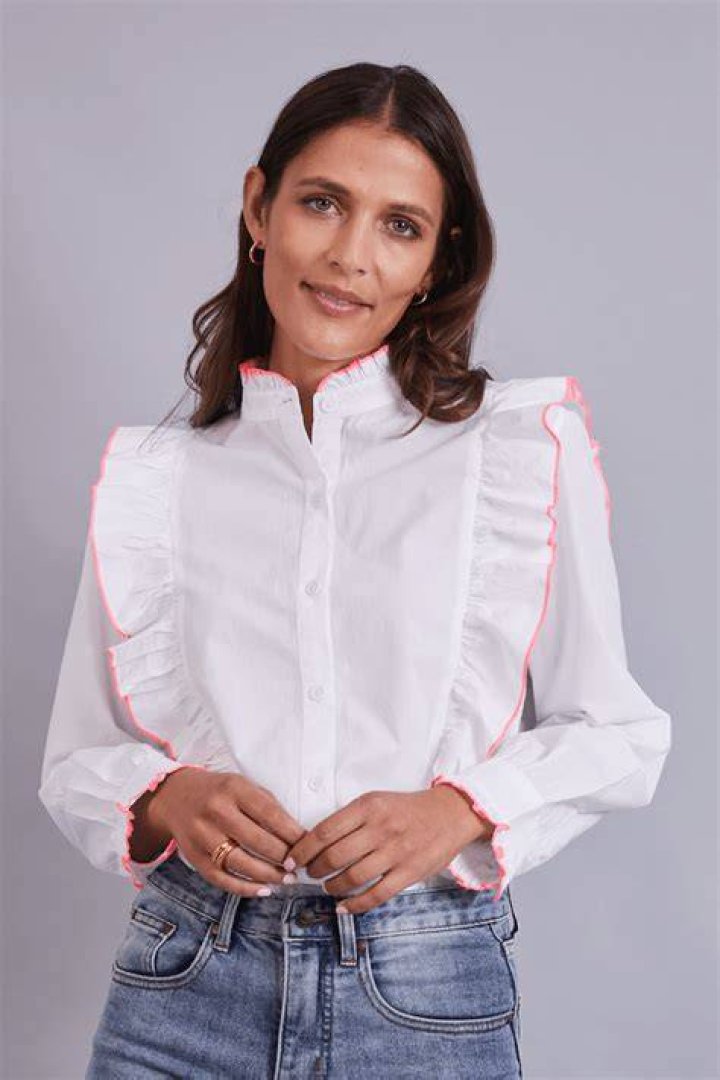 Turk wore a white blouse, athletic tights and flip-flops